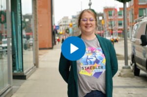 Thumbnail with play button of Joanna standing on King Street in Kitchener