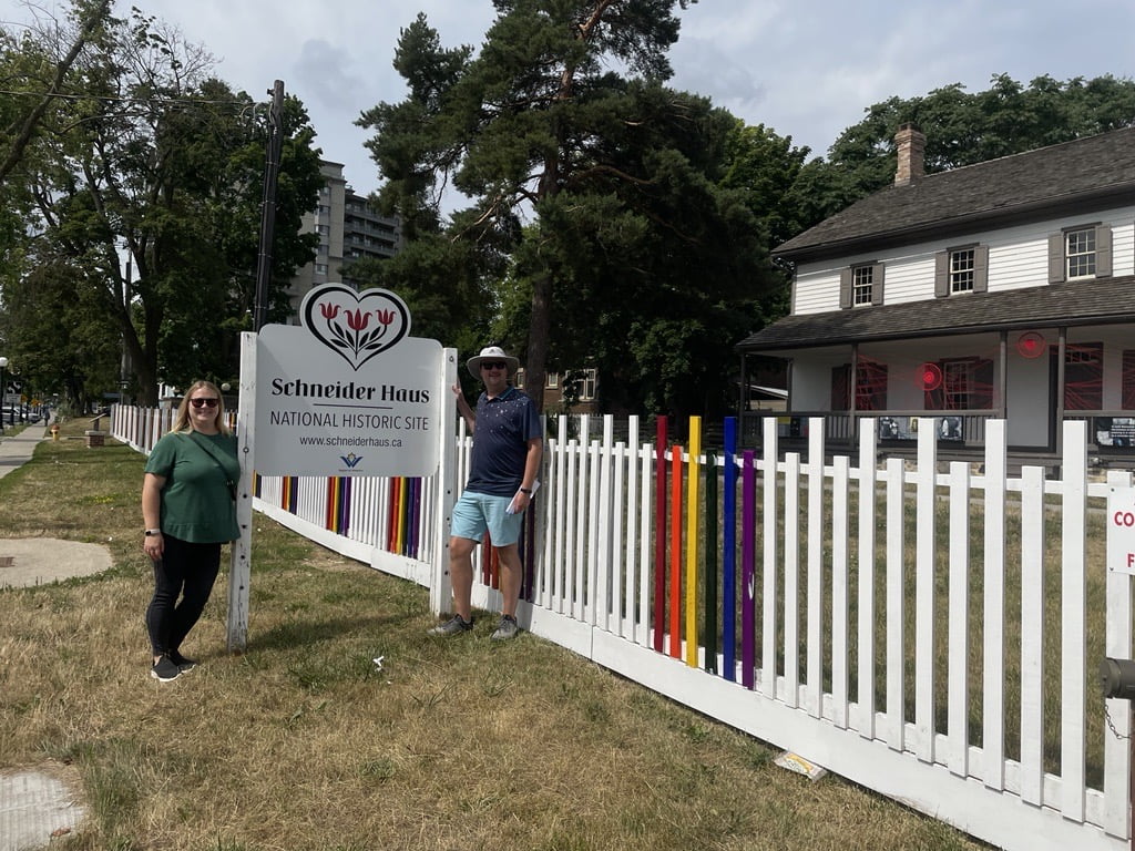 DTK Crawl - Schneider Haus Joanna and Jared pose beside the Schneider Haus - National Historic Site sign